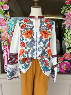 This top is absolutely gorgeous ! The vibrant colors make it a show stopper for sure ! features gorgeous floral embroidery with aztec embroidery on the sleeves Features a one button closure on the neckline Available in size small-3x 100% polyester Aztec Embroidery, Gift Card Games, Bell Skirt, Cardigan Vest, Embroidered Top, Dress Romper, Floral Embroidery, Black Boots, Make It