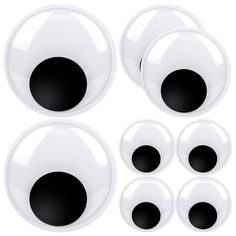 six black and white circles are shown in the shape of an eyeball, with four smaller round ones on each side