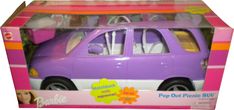 a purple toy car in a pink and white box with flowers on the front window