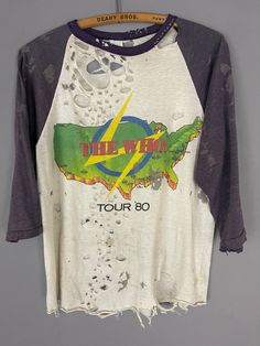 "The Who 1980 TOUR shirt RARE raglan trashed T-shirt burnout paper thin, destroyed, 50/50 baseball tee * Paper thin and see thru with lots of holes, stains VERY distressed (see photo for details) TAG SIZE: Medium MATERIAL: 50/50 MEASUREMENTS LAYING FLAT in inches: SHOULDER TO SHOULDER: 19\" ARMPIT TO ARMPIT: 19\" LENGTH NECK to WAISTLINE: 22\" SLEEVE LENGTH: 14\" # 408" Distressed T-shirt, Tour Tee Shirts, Vintage Raglan Tee, Vintage Baseball Tee, Destroyed T Shirt, Distressed Tshirt, Vintage Tee Shirts, Distressed T Shirt, Distressed Shirt