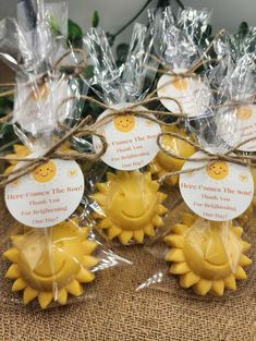 small yellow sunflowers wrapped in cellophane and tied with twine