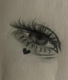 a drawing of an eye with long lashes and a heart in the middle of it