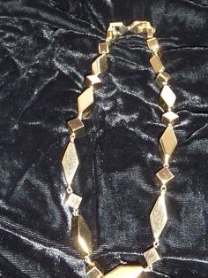 "This is an estate find that appears to have not been worn much. It's a very substantial 15\" choker by Monet that weighs 2.5oz. very bright shiny gold with geometric pattern. Interesting it has an extender on it that I have not seen before - also marked Monet so it can be taken off which makes it a 14\" necklace." Gold 16 Inch Costume Jewelry Necklace, Gold 16 Inch Costume Jewelry, 16 Inch Gold Costume Jewelry Necklace, Diamond-shaped Gold Jewelry For Party, Gold Diamond-shaped Party Jewelry, Gold Costume Jewelry Choker For Evening, Formal Metal Costume Jewelry Choker, Formal Metal Costume Choker, Gold Metal Evening Necklace