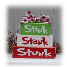 a stack of stacked blocks with the words stink, stak and stuk on them