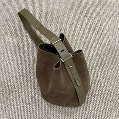 Made of high-quality cowhide, soft and thick. Material: Cowhide Lining: Fabric Comes with an internal cotton bag Size: 34*21*29CM(13*8*11") Khaki Bucket Bag With Double Handle For Daily Use, Khaki Double Handle Bucket Bag For Daily Use, Khaki Leather Satchel With Adjustable Strap, Brown Bucket Hobo Bag For Daily Use, Khaki Bucket Bag With Adjustable Strap And Tote Shape, Large Capacity Leather Shoulder Bag In Khaki, Khaki Leather Shoulder Bag With Leather Handles, Khaki Leather Shoulder Bag With Large Capacity, Khaki Leather Shoulder Bag Large Capacity