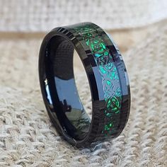 black ceramic ring with green laser inlay