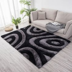 a living room with a couch and rug on the floor