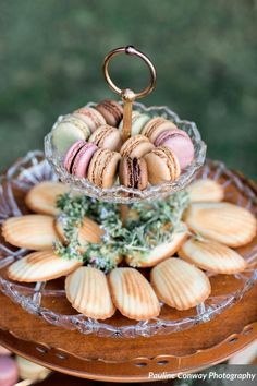 an assortment of macaroons on a glass platter