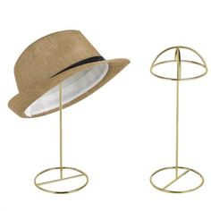 two hats on stands with one wearing a hat