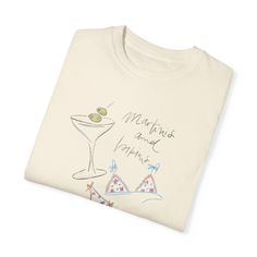 The Martinis & Bikinis Premium Tee is soft, comfy, and vintage-inspired. Our garment-dyed t-shirts are made with 100% with ring-spun cotton that is comfortable against your skin with the perfect relaxed fit. Product details: * Made with 6.1 oz/yd² fabric consisting of high quality, 100% ring-spun US cotton that is ethically grown and harvested. Trust Protocol ensuring ethical and sustainable means of production. * The pre-schrunk fabric that ensures a relaxed fit with a crew neckline. Cotton Graphic Print Tops For Lounging, Cotton Crew Neck T-shirt For Lounging, Relaxed Fit Graphic Print Top For Lounging, Graphic Print Crew Neck Top For Lounging, Summer Lounging T-shirt With Short Sleeves, Summer Cotton Tops For Lounging, Summer Relaxed Fit T-shirt For Lounging, Cotton Tops For Summer Lounging, Summer Cotton T-shirt For Lounging