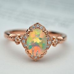 Natural opal engagement ring halo rose gold vintage inspired Faceted Wedding Bands, Fire Opal Engagement Ring, Vintage Opal Engagement Ring, Rose Gold Halo Engagement Ring, Oval Halo Engagement Ring, Engagement Ring Halo, Vintage Inspired Engagement Rings, Opal Engagement Ring, Engagement Rings Vintage Halo