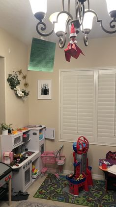 a child's play room with toys and decor