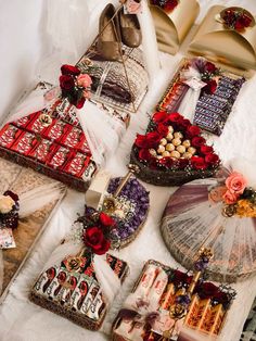 a table topped with lots of different types of cakes and desserts on top of it