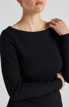 It’s the perfect layering piece, cut from the softest fabric you have ever felt. Featuring a classic boat neckline, long fitted sleeves, and a body-hugging fit throughout, it’s perfect on its own or under a sweater for extra warmth.   At LOSANO we help elevate every moment with clothing that is better for you! Boat Neck Hip length Scoop hem Buttery-soft ribbed fabric PFA Free BPA Free Moisture Wicking Breathable Enhanced Color Protection Made from sustainable materials Fits true to size 47% supi Elegant Boat Neck Top For Layering, Elegant Black Boat Neck Top, Fitted Boat Neck Winter Tops, Elegant Boat Neck Tops For Fall, Classic Boat, Fitted Sleeves, Classic Boats, Boat Neckline, Supima Cotton