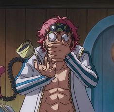 an anime character with pink hair and goggles on his face holding a phone to his ear