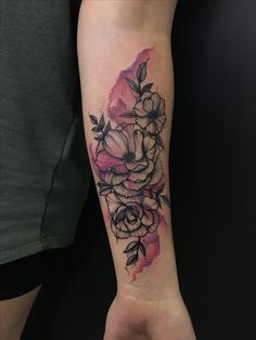 a woman's arm with flowers on it