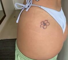 a woman's stomach with a flower tattoo on her belly and the words, what do you think?