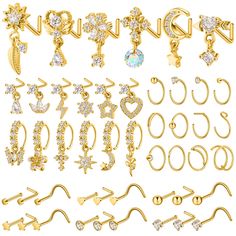 various types of gold earrings and earring sets with crystal stones on them, all in different shapes and sizes