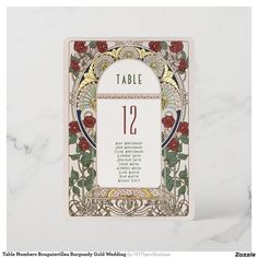 the table numbers are displayed in this art nouveau style wedding stationery card design, which features roses and leaves