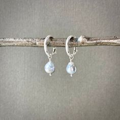 "✦These pearl hoop earrings are perfect for any occasion!  Natural round ice blue Akoya (saltwater) pearls, measuring about 8mm in length and 7mm in diameter, dangle from all sterlings 925 silver huggie hoops. The hoops have a hinge on the ear wire to make them easy to put on and take off, as well as ensure they are securely attached to the earlobes.  ✦Materials and measurements: - sterling silver huggie latching hoops, 15mm outer diameter, 12mm inner diameter, -  1 inch in length. - Natural drop-shaped round ice blue Akoya Japanese salt water pearls, 7-8 mm. ✦Also available in gold filled: https://www.etsy.com/listing/869317938 ✦Check out more Akoya pearl jewelry here: https://www.etsy.com/shop/WendyShrayDesigns?ref=seller-platform-mcnav&search_query=akoya ✦Your jewelry will be packaged i Silver Akoya Pearl Earrings For Gift, Handmade Blue Pearl Earrings In Sterling Silver, Fine Jewelry Silver Akoya Pearl Earrings, Hypoallergenic Sterling Silver Hoop Pearl Earrings, Nickel-free Silver Hoop Pearl Earrings, Diy Jewelry Projects, Saltwater Pearls, Pearl Hoop Earrings, Akoya Pearls