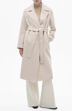 Add timeless worth with a wool-blend wrap coat turned out in a snowy shade. Open front Notched lapels Side-seam pockets Back vent Removable sash Lined 53% wool, 46% polyester, 1% acrylic Dry clean Imported Chic Belted Beige Wool Coat, Chic Belted Wool Coat, Chic Beige Wool Coat With Lapel Collar, Elegant Beige Wool Coat With Pockets, Elegant Cream Outerwear With Belted Cuffs, Chic Cream Wool Coat For Formal Occasions, Chic Spring Wool Coat With Belt, Elegant Neutral Wool Coat For Winter, Elegant Beige Belted Outerwear