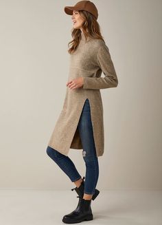 A luxe heathered knit in a lofty soft fabric, knee length tunic with long sleeves, mock neck, deep front side slit, all made of recycled fibers and wool blended perfectly with a relaxed urban silhouette. Available in 2 colours Heather Brown, Heather Grey. 50% Recycled Polyester, 30% Nylon, 14% Polyester, 6% Fine Wool. Heather Brown, Neck Deep, Fall Shopping, Tunic Sweater, Long Sweaters, 2 Colours, Baby Shop, Soft Fabric, Mock Neck