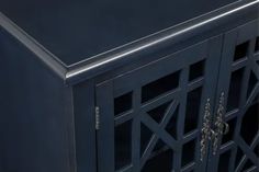 an ornate black cabinet with glass doors