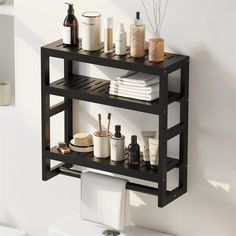 a bathroom shelf that has some toiletries and soaps on it, in front of a white wall