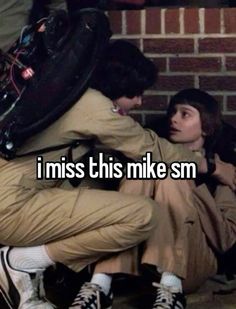 two people sitting next to each other with the words i miss this mike sm