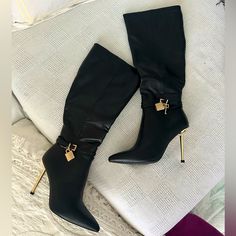 It’s Giving Luxury. These Boots Have A Vegan Leather Construction, A Pointed Toe Design, Gold Finish Stiletto Heels, Wrap Around Ankle Buckle Closures With A Gold Lock And Key Charm On The Sides, And Side Zipper Closures. Heel Height: 4.25" Approx Elegant High Heel Knee-high Boots In Faux Leather, Elegant High Heel Faux Leather Knee-high Boots, Elegant High Heel Knee-high Faux Leather Boots, Chic Faux Leather Knee-high Boots With Closed Toe, Chic High Heel Faux Leather Boots, Elegant Knee-high High Heel Faux Leather Boots, Chic Knee-high Heels For Night Out, Elegant Faux Leather Boots With Buckle Closure, Knee-high Faux Leather Evening Heels