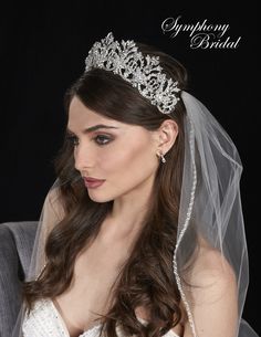 a woman wearing a wedding veil and tiara