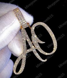 a gold and diamond initial brooch