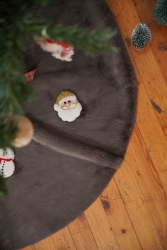 small christmas ornaments are placed on the floor