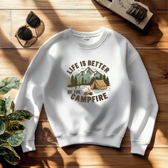 Embrace your love for the outdoors with this cozy red sweatshirt, featuring a serene campfire scene with a tent, trees, and mountains. Perfect for camping trips or cozying up around the fire, this design is a must-have for nature lovers and adventurers. Stay warm and stylish with this nature-inspired sweatshirt. A sturdy and warm sweatshirt bound to keep you warm in the colder months. A pre-shrunk, classic fit sweater that's made with air-jet spun yarn for a soft feel. * 50% cotton, 50% polyester * Pre-shrunk * Classic fit * 1x1 athletic rib knit collar with spandex * Air-jet spun yarn with a soft feel * Double-needle stitched collar, shoulders, armholes, cuffs, and hem This product is made especially for you as soon as you place an order, which is why it takes us a bit longer to deliver i Campfire Scene, Red Sweatshirt, Fitted Sweater, Air Jet, Nature Lovers, Camping Trips, The Fire, Campfire, The Outdoors