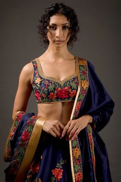 Editor's Note Chanderi Silk Lehenga With Resham Thread Embroidery And Hand Embroidery Work Paired With Chanderi Silk Embroidered Dupatta & Blouse Color: Indigo Fabric: Chanderi Silk Care: Dry Clean Only About the Designer Rohit Bal is intensely concerned with design as an art form. The designer draws on history, fantasy and folklore to create masterpieces that are desired by discerning aficionados around the globe. Rohit has a deep understanding of the psyche of the fashion world and it reflects