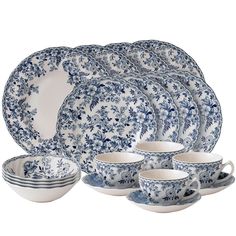 a blue and white dinner set with matching plates