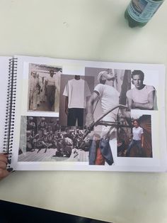 a person holding up a book with photos on it