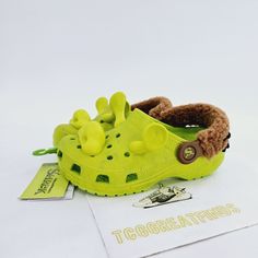 Brand New Without Box. Smoke Free Home. Crocs Shrek Classic Clog K Casual Kid's Shoes Style Code: 209378-3tx Size: J1 Us / J1 Uk / 32-33eur. Size: C13 Us / C13 Uk / 30-31eur. Size: C12 Us / C12 Uk / 29-30eur. Size: C11 Us / C11 Uk / 28-29eur. Color: Green/Brown We Will Have Your Shoes Packed And Boxed Carefully And Shipped Out Within 1 Business Day (Often The Same Day). We Pride Ourselves On Extremely Fast Shipping! Synthetic Slip-on Clogs For Playtime, Playful Non-slip Slip-on Clogs, Cute Green Non-slip Slippers, Green Outdoor Slippers With Round Toe, Green Round Toe Outdoor Slippers, Cute Synthetic Clogs For Playtime, Cute Green Slippers With Round Toe, Playful Plastic Clogs With Round Toe, Green Non-slip Closed Toe Slippers