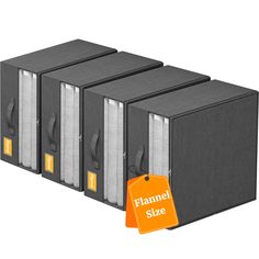 three black binders with orange tags attached to them