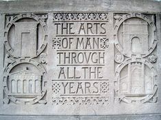 the words are carved into the side of a stone wall that reads, the arts of man through all the years