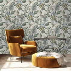 a chair and ottoman in front of a floral wallpaper