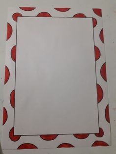 a piece of paper with red circles on it