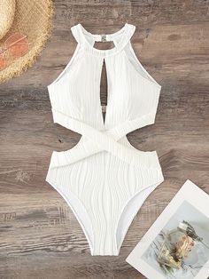 Elevate your poolside style with our elegant Cut Out Waist Halter One Piece Swimsuit. This plain yet sophisticated swimsuit features a high neck and chic cut-out waist, complemented by a backless design and ruched details. The bikini bottom type and wireless bra provide a comfortable fit, while the high-stretch fabric and removable padding ensure customizable support. Perfect for lounging in style, this swimsuit is recommended for poolside use and is not water-resistant. 95% Polyester, 5% Elasta Poolside Style, Swimsuit For Body Type, Backless One Piece Swimsuit, Poolside Fashion, Trendy Swimsuits, Perfect Swimsuit, Swimwear High Waisted, Swimsuit Sale, Swimsuit Design