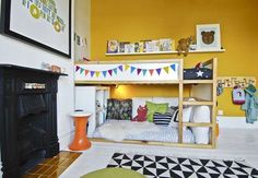 there is a bunk bed in the corner of this room with yellow walls and white flooring