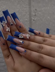 Royal Blue And Gold Butterfly Nails, Tapered Square Nails Royal Blue, Rolay Blue Acrylic Nails, Long Acrylic Blue Nails, Dark Blue Acyrilics Nails, Royal Blue Nails With Charms, Royal Blue Acrylic Nails For Graduation, Long Blue Acrylic Nails With Rhinestones, Blue Nails Birthday Set