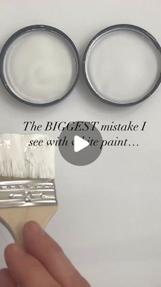 a hand holding a paint brush with the words the biggest mistake i see with it's paint