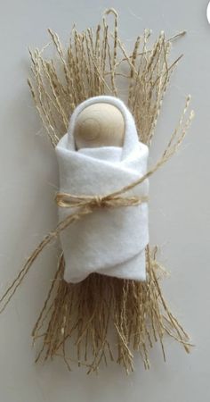 a white towel wrapped in twine with a wooden button