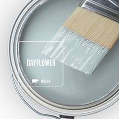 a paint can with a brush in it and the words light french gray on top