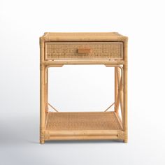 a wicker side table with two drawers on one shelf and an open drawer on the other