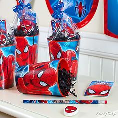 spiderman birthday party supplies on a table